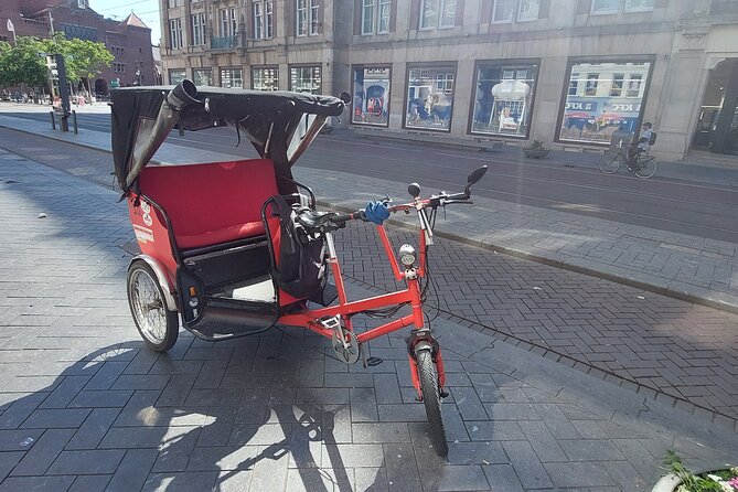 2 Hours Private Amsterdam Rickshaw Tour - Skinny Bridge and canal design: a quick stop that sharpens your Amsterdam eye