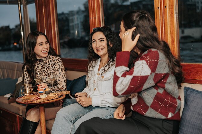Amsterdam: 2-Hour Canal Cruise incl. Drinks & Dutch Snacks - Quirky stops: cats, the cheese museum, and blue bridge stories