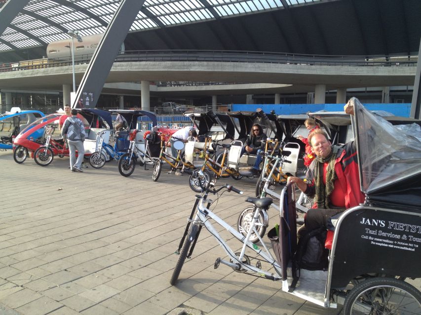 Amsterdam: 2-Hour Sightseeing Tour by Rickshaw - Comfort, rain cover, and what to bring (and what not to)