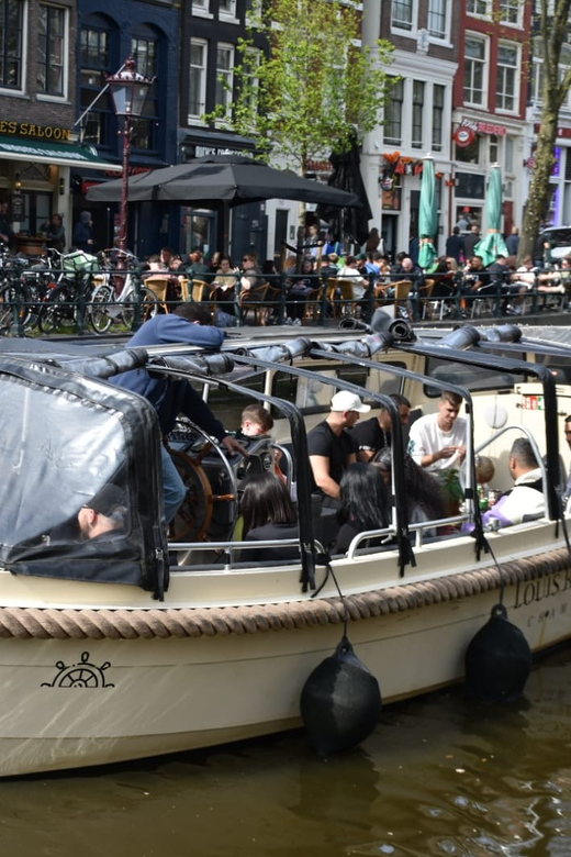 Amsterdam: 420 Smoke-Friendly Boat Tour - Rolling your own 420 and enjoying the reggae soundtrack