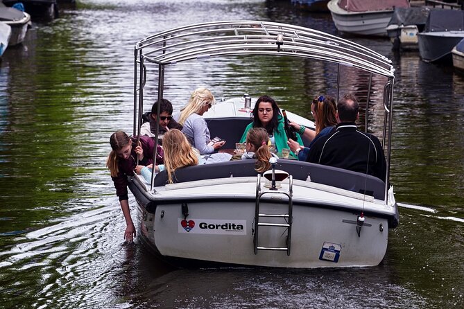 Amsterdam 90-min Private Canal Cruise with Live Guide and Drinks - UNESCO canal belt and the Golden Bend: where power shows up in brick