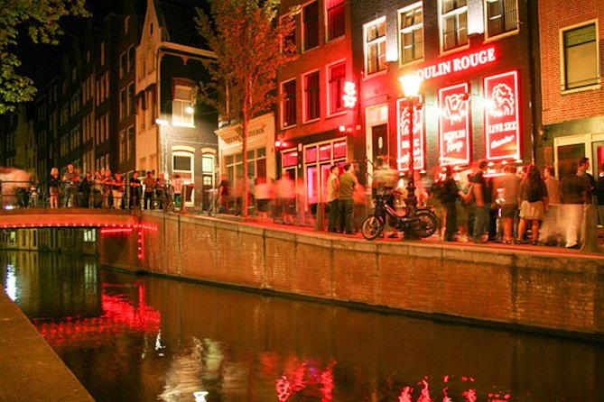 Amsterdam After Dark: Public Red Light District Exploration - The narrowest street and the Route 66 bar with a reserved VIP table