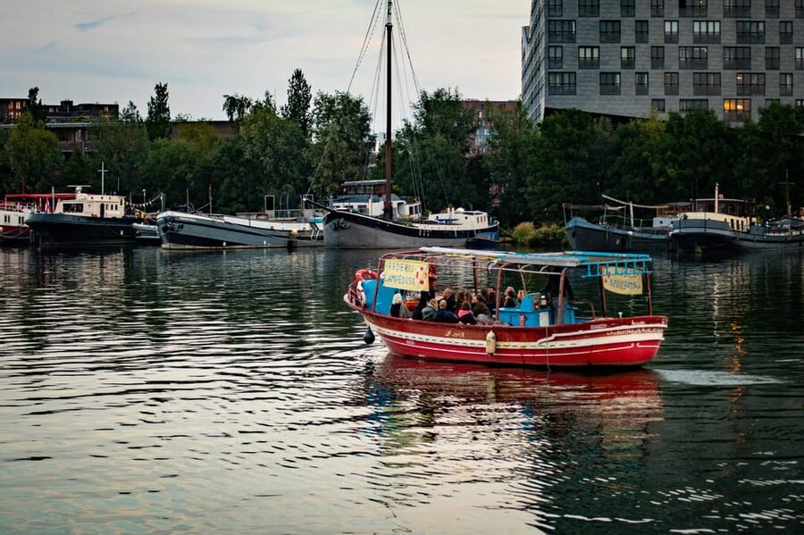 Amsterdam: Canal Cruise on a Wooden Refugee Boat - Open-Boat Comfort, Rain Plans, and What to Bring