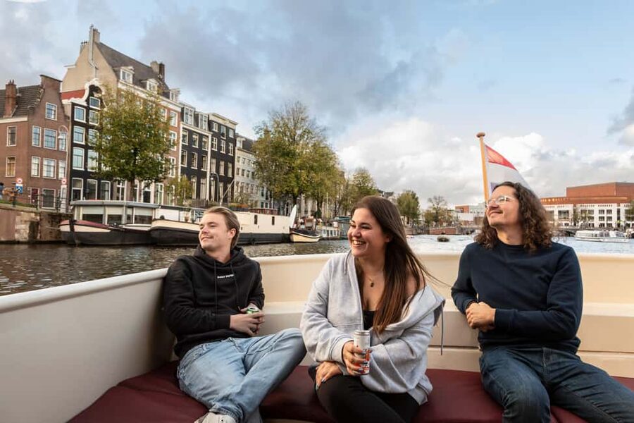 Amsterdam: Canal Cruise with Live Commentary & Audio Guide - How the narration works: live captain talk plus the audio guide