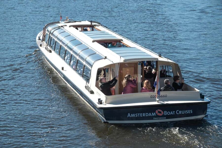 Amsterdam: Canal Cruise with Live Commentary & Audio Guide - Onboard comfort: covered roof, heating, and that onboard toilet