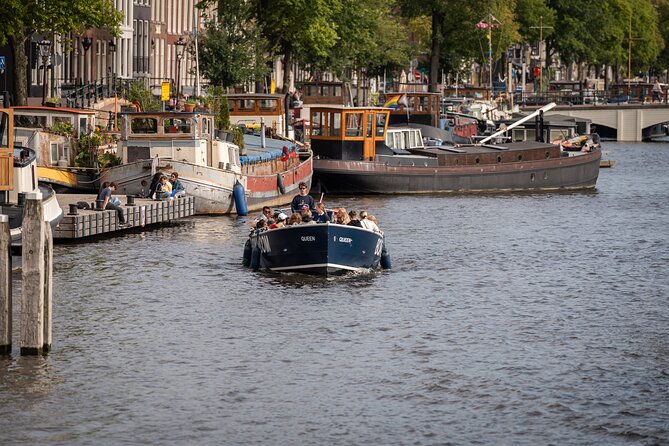 Amsterdam Canal Cruise with Live guide & Two drinks - Central St. - Old City Centre Views: Small Canals, Church Stops, and Central Station From the Water