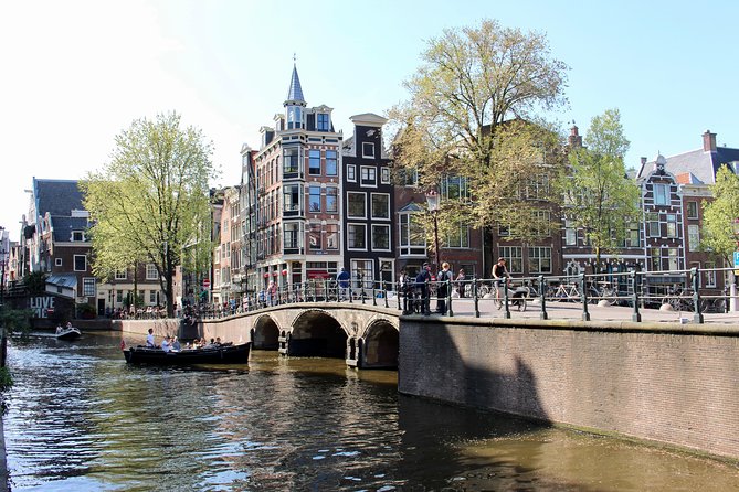 Amsterdam Canal Tour by Open Boat – 90 min Small Group Experience - Amstel River start: dancing houses, leaning buildings, and the easy sightseeing flow