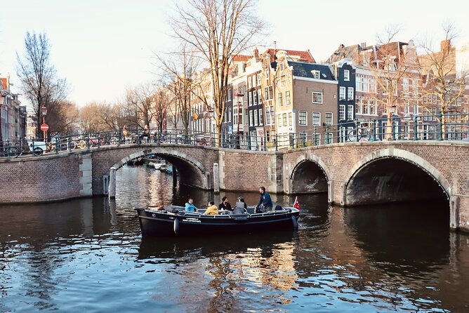 Amsterdam Canal Tour by Open Boat – 90 min Small Group Experience - Kolksluis and the 17th to 18th-century warehouses near the medieval lock