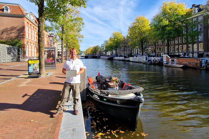 Amsterdam Canal Tour by Open Boat – 90 min Small Group Experience - Nieuwmarkt and de Waag: a former gate with multiple careers