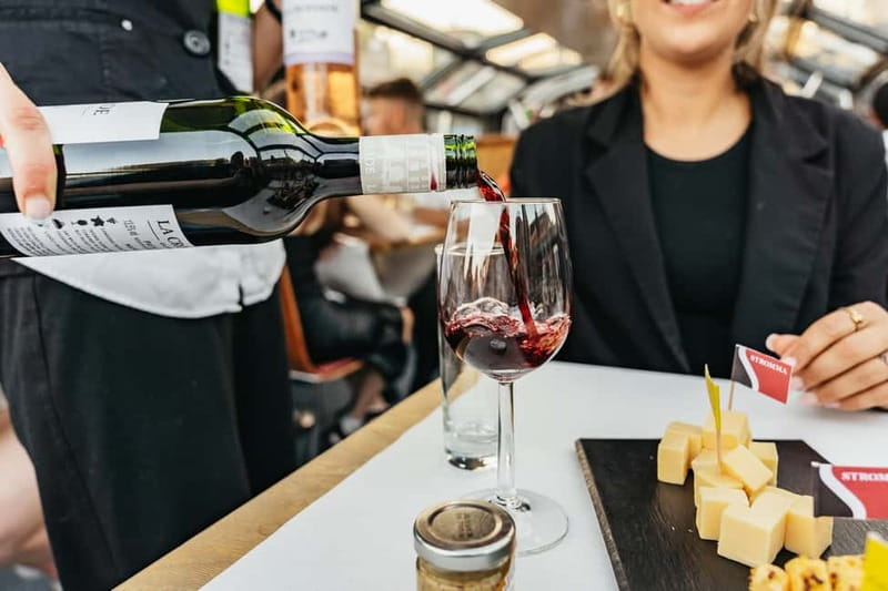 Amsterdam: Cheese & Wine Cruise Tasting Experience - Heated boat comfort and how the cheese-and-drinks flow works