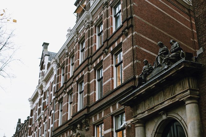 Amsterdam City Center Guided Walking Tour Semi-Private 12ppl Max - Stop-by-stop: from St. Nicholas Basilica to Papeneiland