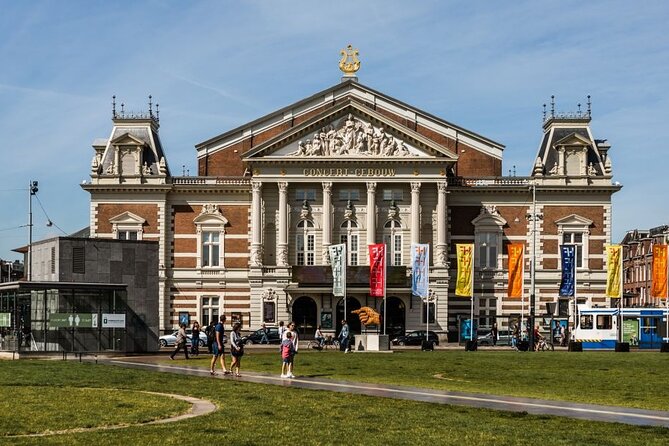Amsterdam City Highlights and Hidden Gems - Private & Custom Tour - A relaxed central square: bookstores, cafés, and hidden passageways