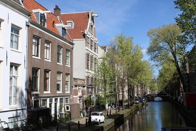 Amsterdam: City walking experience with a local - Nieuwmarkt Square: modern life layered over older streets