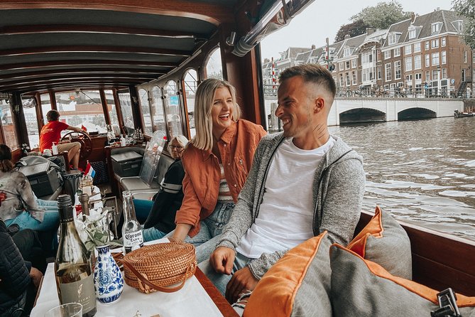 Amsterdam Classic Saloon Boat Cruise with Drinks and Cheese - Landmark by landmark: what you are really looking at