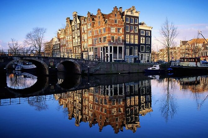 Amsterdam: E-Bike Sightseeing Tour - Dam Square landmarks: the fast intro that saves your whole trip