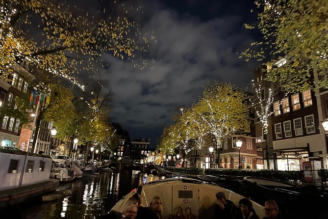 Amsterdam Evening Cosy & Small Cruise & Drinks and Bites - Sunset - Sunset canal views from an open electric boat