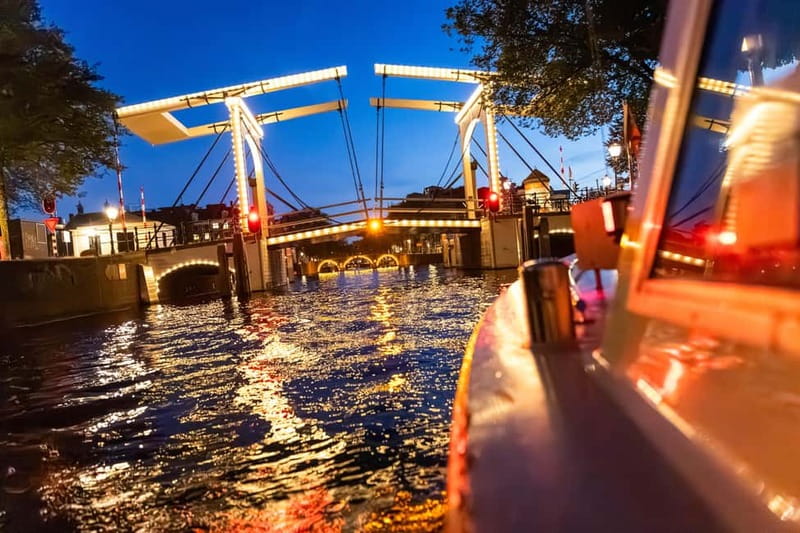 Amsterdam: Evening Cruise with Optional Wine and Snacks - What happens on board: audio commentary, earphones, and onboard comfort
