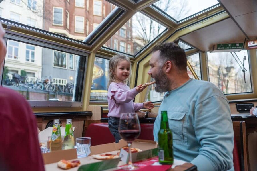 Amsterdam: Evening Pizza Cruise Along the Canals - Where you go on the water: Damrak to the Canal Belt and beyond