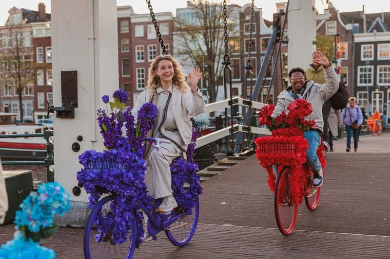 Amsterdam: Explore Canals, Guided Tour on Flower Bikes - A 1.5-hour route through canals, squares, and classic neighborhoods