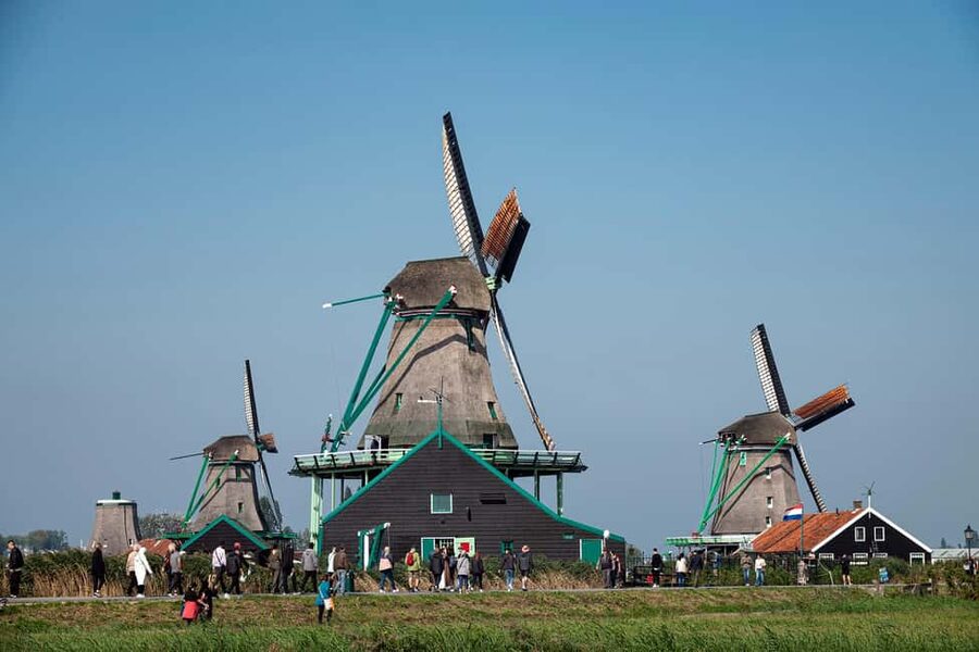 Amsterdam: Explore Zaanse Schans: Half-Day Luxury Coach Trip - Getting to This is Holland: the ferry shortcut and quick check-in