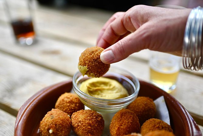 Amsterdam Food Tour of 10+ Local Classic Tastings in Jordaan Area - Fishmonger Energy: Herring and Kibbeling in the Middle of the Neighborhood