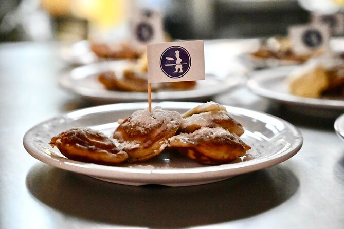Amsterdam Food Tour of 10+ Local Classic Tastings in Jordaan Area - Stop 1 in the Jordaan: Poffertjes, Cheese, and the Shape of Dutch Snacking