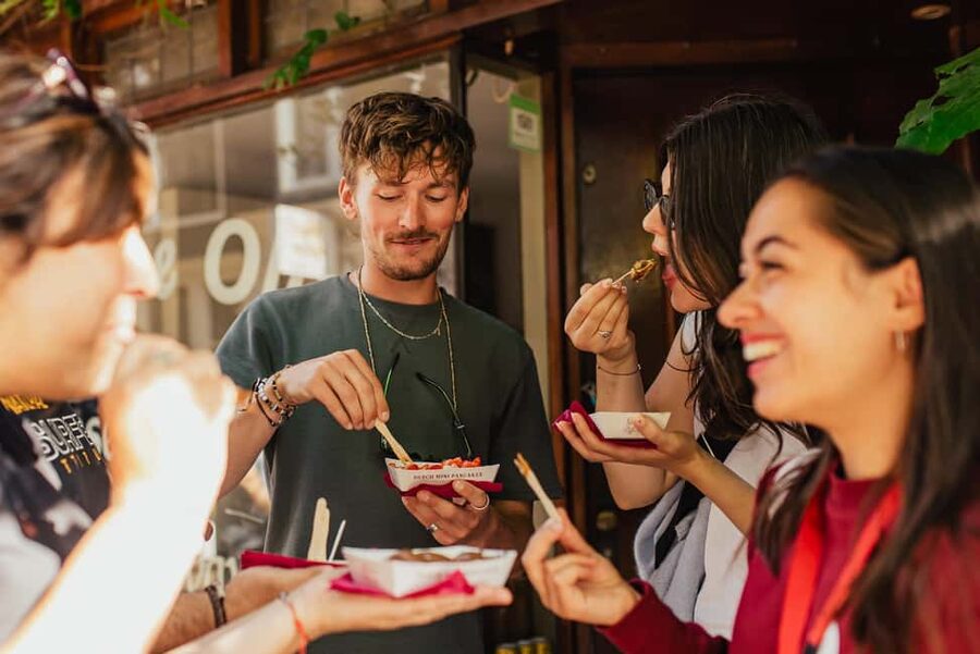 Amsterdam: Guided Cultural Food Tour in German or English - Damrak Avenue, Beurs van Berlage, and Magna Plaza