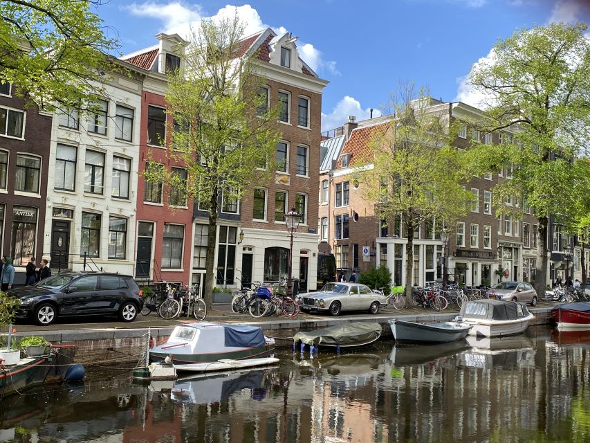 Amsterdam: Guided Off-The-Beaten-Track Walking Tour - Starting at Beursplein: the right warm-up for your Amsterdam map