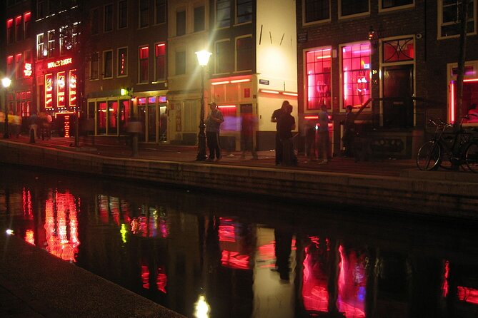Amsterdam: Guided Red Light District and City Walking Tour - The Smallest House: VOC Storage to Long-Term Living
