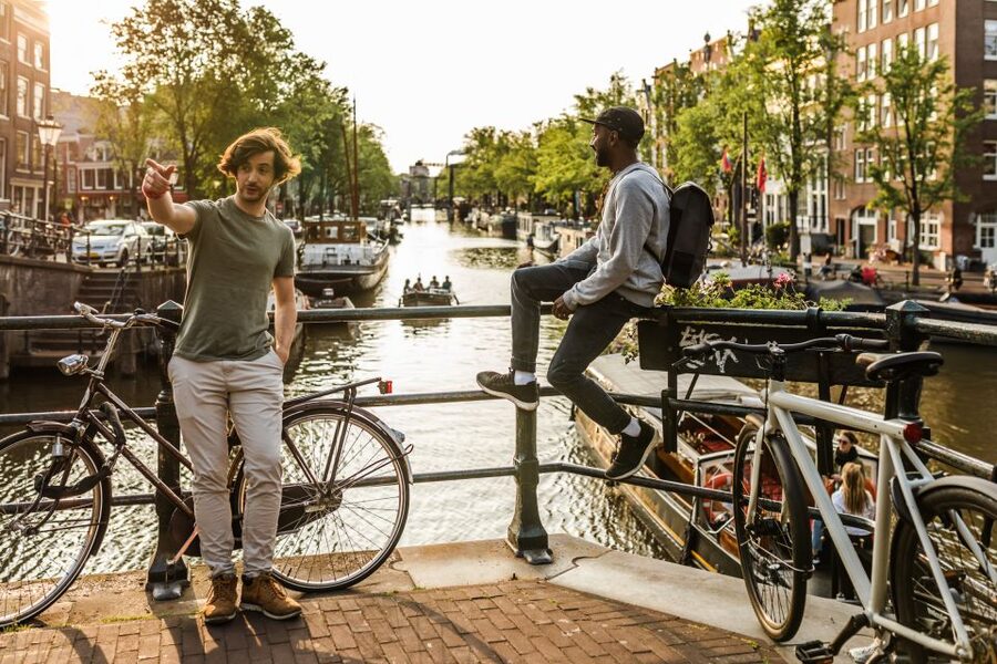 Amsterdam: Highlights & Hidden Gems Private Walking Tour - Canal banks and Bloemenmarkt, the floating flower market founded in 1862