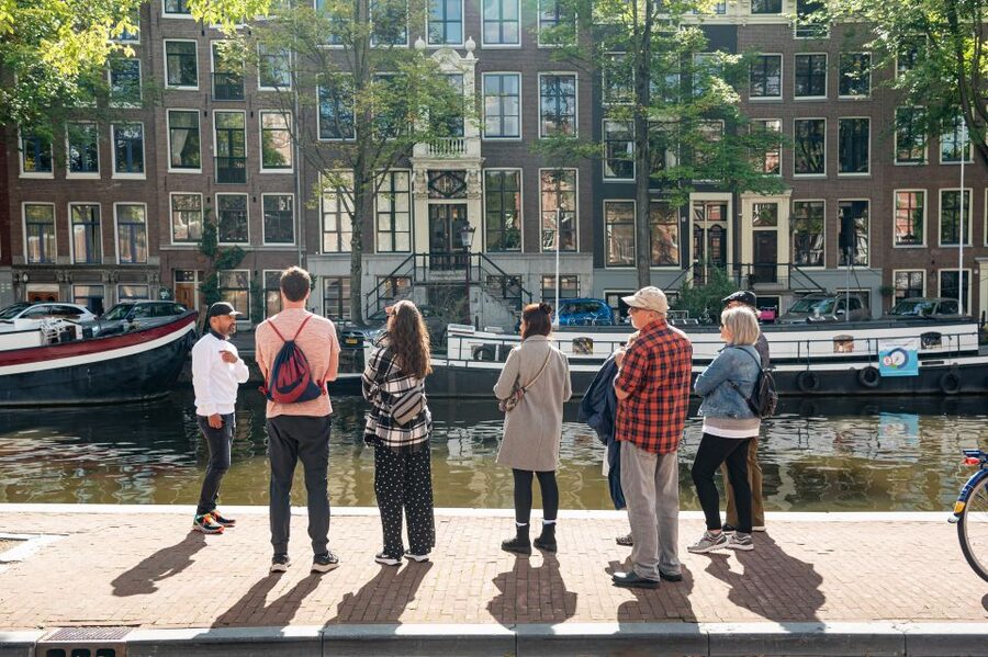 Amsterdam: Highlights & History Walking Tour - Canal strolls, crooked houses, and the Flower Market finale