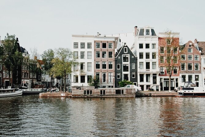 Amsterdam Highlights Walking Tour - Begijnhof: a quiet courtyard break from the noise