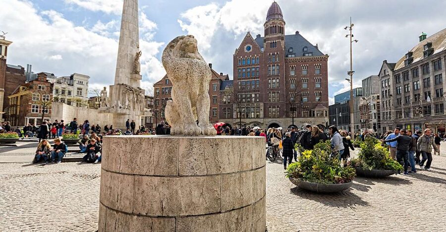 Amsterdam: Historic Walking Tour - Dam Square and the palace that began as city hall