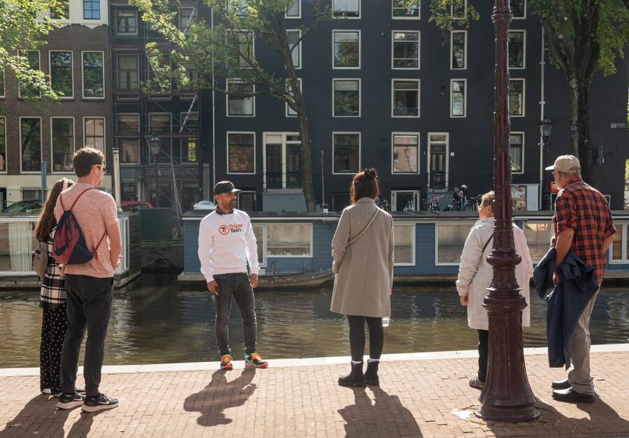 Amsterdam: Jewish Quarter and History Guided Tour - Entering WWII Amsterdam From the Amstel River