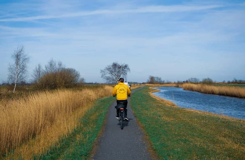 Amsterdam: Leisurely Windmill & Countryside Bike Ride - North Holland Canal and the old-windmill feel before the main stop