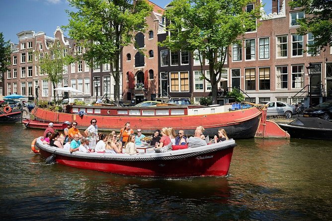 Amsterdam Light Festival: Saloon Boat Cruise + Hot Drinks & Bite - Entering Amsterdam Light Festival, the Canal Way