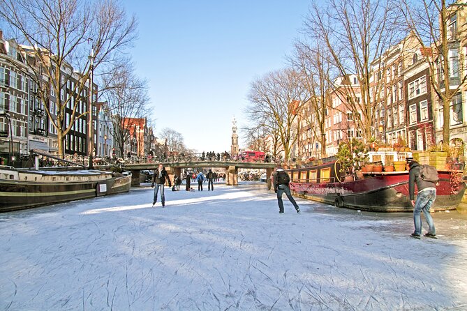Amsterdam Light Festival Winter Walk with Stroopwafel Workshop - Dam Square, the Royal Palace, and how to spot your guide fast