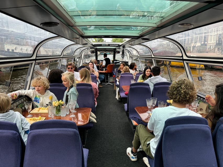 Amsterdam: Luxury Cheese & Wine Canal Cruise - The guide and the stories: how the hour stays lively