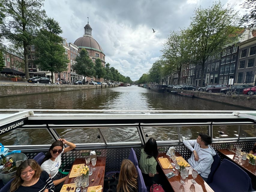 Amsterdam: Luxury Cheese & Wine Canal Cruise - When an open boat makes you glad you planned ahead
