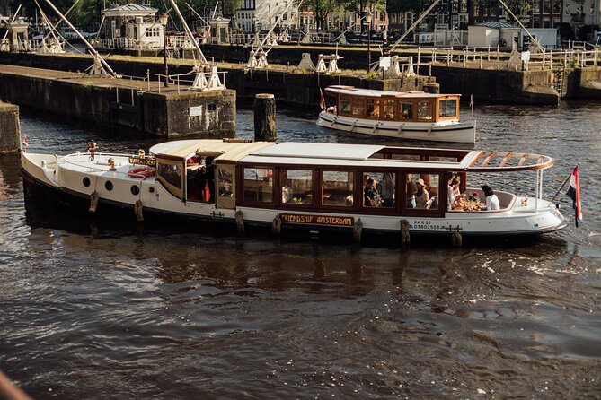 Amsterdam: Luxury Saloon Boat Cruise with Cocktails & Waffle - Open Boat Views, Blankets, and the Seat Reality Check