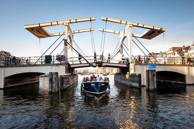 Amsterdam Open Boat Cruise in Old City Center with Live Guide - Boarding at Amstel 51F, in front of the Hermitage