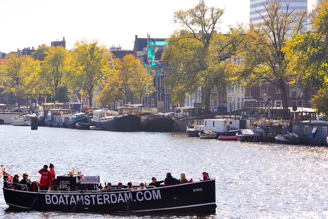 Amsterdam Open Boat Cruise in Old City Centre with Drinks Options - Entering Amsterdam from the water, not the sidewalk
