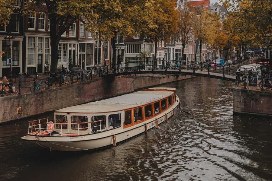 Amsterdam: Open Boat Cruise option Unlimited Drinks & Bite - Hermitage Museum, Skinny Bridge, Amstel Hotel, and Grachtengordel