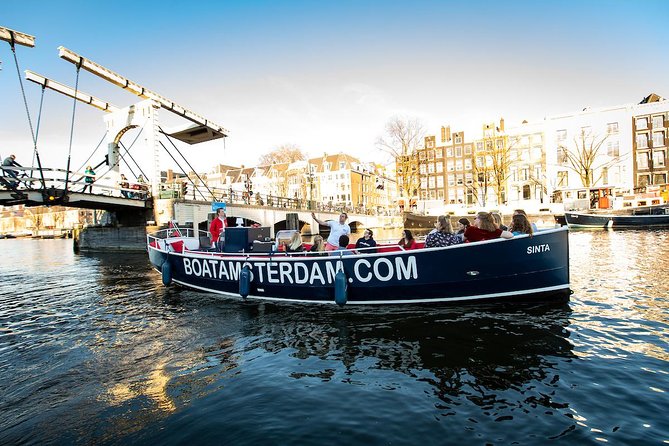 Amsterdam Open Boat Cruise with Live Guide and Two Drinks - Small group energy, families, and the guide names you might hear