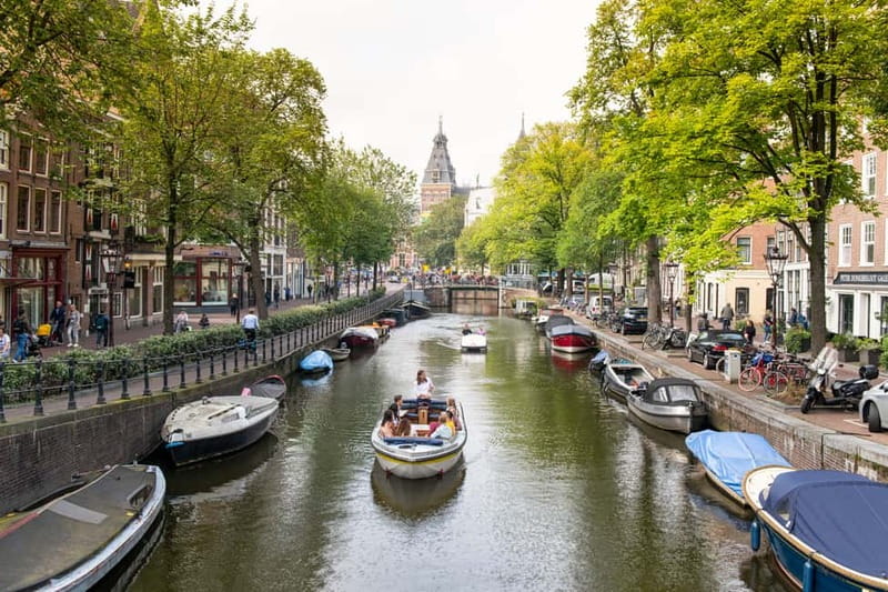 Amsterdam: Open Boat Tour of Canals with Expert Local Guide - Why an Open-Boat Canal Tour Beats the Big Tourist Boats