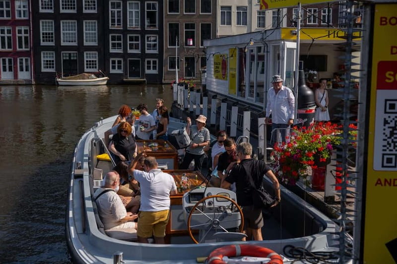 Amsterdam: Open Boat Tour of Canals with Expert Local Guide - Your 1-Hour Route: Centraal, Prinsengracht, Rijksmuseum, and Magere Brug