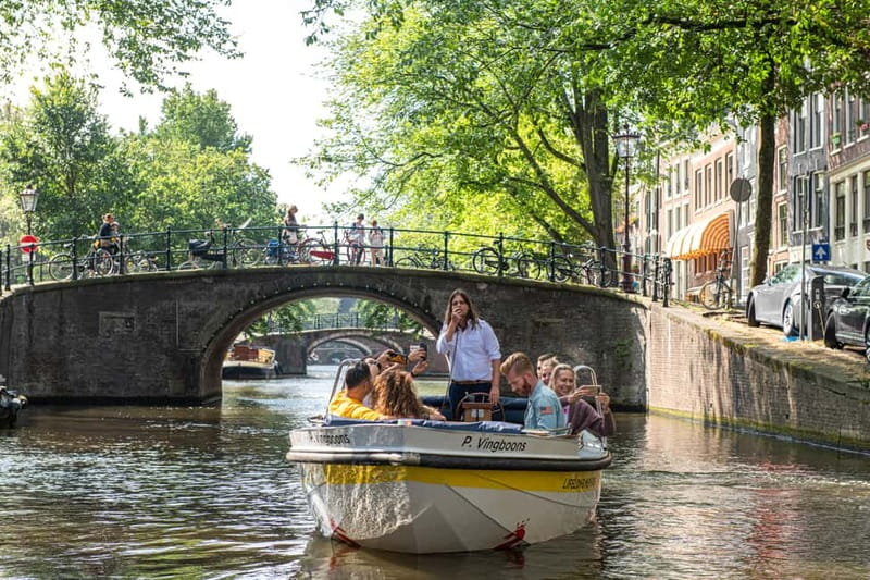 Amsterdam: Open Boat Tour of Canals with Expert Local Guide - Choosing Your Start Point: Damrak 22, Rijksmuseum, or Prins Hendrikkade