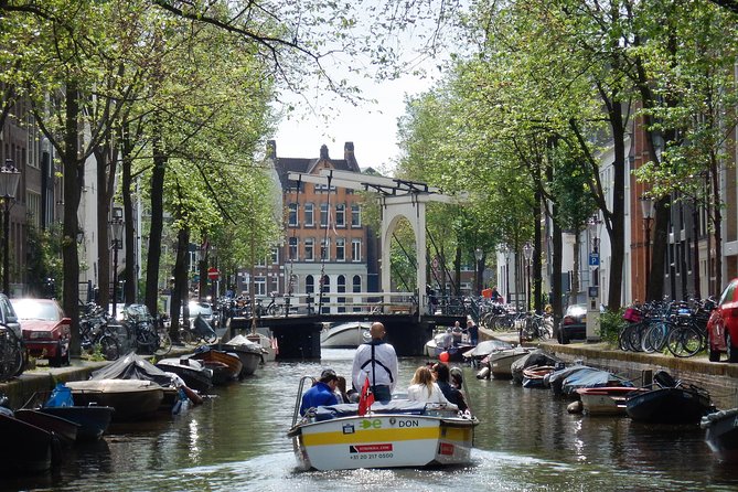 Amsterdam Open Boat Tour with Local Guide - Your canal route: from historic waterways to the Seven Bridges view