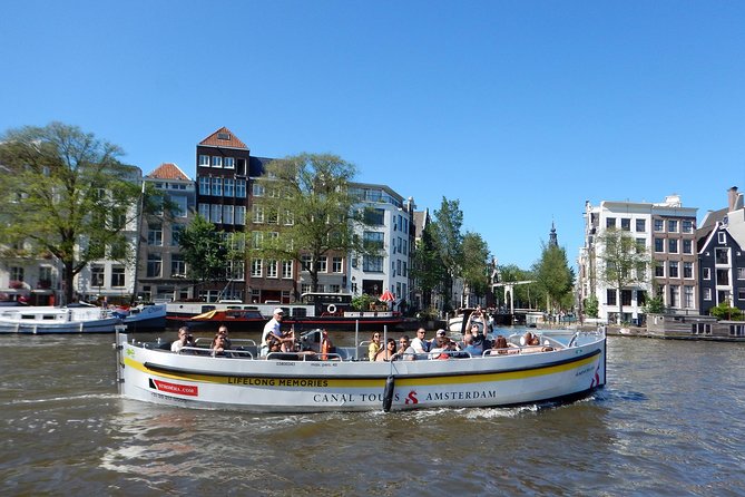 Amsterdam Open Boat Tour with Local Guide - What you actually get: included guide, toilet on the mooring, and no food plan