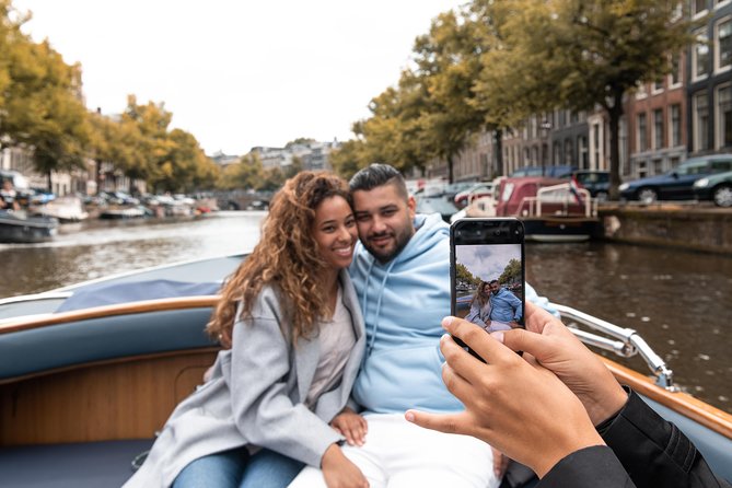 Amsterdam Open Boat Tour with Local Guide - Captain-guided narration, no earbuds required
